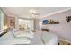 Main bedroom with a view into the sunroom at 2111 Outer Dr, Sarasota, FL 34231
