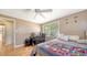 Bedroom with a ceiling fan, comfortable bed and built-in closet at 2111 Outer Dr, Sarasota, FL 34231