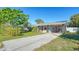 Cute bungalow with covered carport, and a fenced-in backyard at 2111 Outer Dr, Sarasota, FL 34231