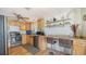 Well-equipped kitchen with light wood cabinets and stainless steel appliances at 2111 Outer Dr, Sarasota, FL 34231