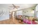 Bright and airy living room with a comfy couch and hardwood floors at 2111 Outer Dr, Sarasota, FL 34231