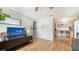 Open living room with hardwood floors and kitchen bar at 2111 Outer Dr, Sarasota, FL 34231