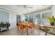 Bright sunroom with table and chairs, perfect for enjoying morning coffee at 2111 Outer Dr, Sarasota, FL 34231