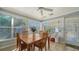 Sunroom features a table for four and plenty of windows at 2111 Outer Dr, Sarasota, FL 34231