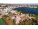 Stunning aerial view showcasing the waterfront neighborhood and its access to the bay at 23 Seaside Ct, Holmes Beach, FL 34217