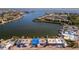 Aerial view features waterfront homes with docks and stunning water views; a haven for coastal relaxation at 23 Seaside Ct, Holmes Beach, FL 34217