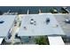 Aerial view of waterfront home with dock access and patio for relaxing and enjoying the coastal breeze at 23 Seaside Ct, Holmes Beach, FL 34217