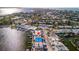 Breathtaking aerial view features waterfront homes, private docks, and lush surroundings, offering a serene escape at 23 Seaside Ct, Holmes Beach, FL 34217