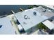 Waterfront property boasts private dock access and an inviting exterior for ultimate coastal lifestyle enjoyment at 23 Seaside Ct, Holmes Beach, FL 34217