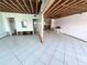 Renovated interior with modern tile flooring and open layout, perfect for creating your dream coastal living space at 23 Seaside Ct, Holmes Beach, FL 34217