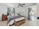 Spacious bedroom with a king-size bed, grey bedding, and plenty of natural light at 2321 Milford Cir, Sarasota, FL 34239