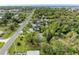 Wide aerial view of property showing road and surrounding houses at 25318 Marion Ave, Punta Gorda, FL 33950