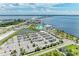 Aerial view of large parking lot adjacent to waterfront resort at 25318 Marion Ave, Punta Gorda, FL 33950