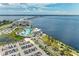 Aerial view of waterfront property showcasing expansive resort amenities and parking at 25318 Marion Ave, Punta Gorda, FL 33950