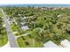 Aerial view of property with road access and mature trees at 25318 Marion Ave, Punta Gorda, FL 33950