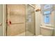 Bathroom with shower stall, toilet, and grab bar at 3213 Sumac Ter, Sarasota, FL 34237