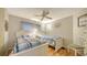 Bedroom with two twin beds and ceiling fan at 3213 Sumac Ter, Sarasota, FL 34237