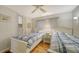 Bedroom with two twin beds and ceiling fan at 3213 Sumac Ter, Sarasota, FL 34237
