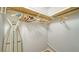 Closet with hanging rods and ironing board at 3213 Sumac Ter, Sarasota, FL 34237