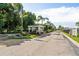 Gated community entrance with guardhouse and flag at 3213 Sumac Ter, Sarasota, FL 34237