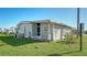 Single-wide mobile home with side yard at 3213 Sumac Ter, Sarasota, FL 34237