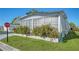 Mobile home with landscaping and a stop sign at 3213 Sumac Ter, Sarasota, FL 34237