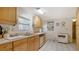 Kitchen with wood cabinets, tile flooring, and appliances at 3213 Sumac Ter, Sarasota, FL 34237