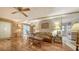 Open living area with hardwood floors, sofa, and adjacent dining area at 3213 Sumac Ter, Sarasota, FL 34237