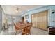 Sunroom features a dining set and sliding glass doors at 3213 Sumac Ter, Sarasota, FL 34237