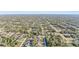 Aerial view of a residential neighborhood showcasing numerous homes and lush green landscape at 3623 Monday Ter, North Port, FL 34286