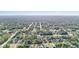 Expansive aerial shot of a residential community surrounded by lush greenery at 3623 Monday Ter, North Port, FL 34286