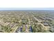 Breathtaking aerial view of a peaceful residential area nestled among dense trees, offering a serene lifestyle at 3623 Monday Ter, North Port, FL 34286