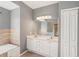 Double vanity bathroom with a large mirror and separate shower and tub at 3623 Monday Ter, North Port, FL 34286