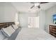 Spacious bedroom with a king-size bed and ensuite bathroom access at 3623 Monday Ter, North Port, FL 34286