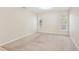 Spacious bedroom with neutral carpet, arched windows, and ample natural light at 3623 Monday Ter, North Port, FL 34286