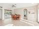 Cozy dining area with tile floors, decorative ceiling fan, and access to the outdoor patio through sliding glass doors at 3623 Monday Ter, North Port, FL 34286