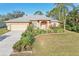 Single-Gathering house with a garage and landscaping at 3623 Monday Ter, North Port, FL 34286