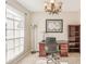 Bright home office features a wood desk and built-in shelving at 3623 Monday Ter, North Port, FL 34286