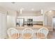 Modern kitchen with stainless steel appliances, a breakfast bar, and ample cabinet space at 3623 Monday Ter, North Port, FL 34286