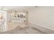 Open living room with carpeted floor and access to kitchen at 3623 Monday Ter, North Port, FL 34286