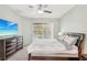 Main bedroom with large TV and pool view at 3623 Monday Ter, North Port, FL 34286