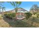 Relaxing screened pool and spa with lush landscaping at 3623 Monday Ter, North Port, FL 34286