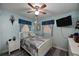 Cozy bedroom with a double bed and light blue walls at 3704 35Th W St, Bradenton, FL 34205