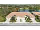 Aerial view of villas with lake and lush landscaping at 4209 Cascade Falls Dr, Sarasota, FL 34243