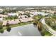 Aerial view of community near lake and road at 4209 Cascade Falls Dr, Sarasota, FL 34243