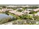 Aerial view of a community with houses, lakes, and lush landscaping at 4209 Cascade Falls Dr, Sarasota, FL 34243