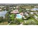 Community pool and clubhouse with lush landscaping at 4209 Cascade Falls Dr, Sarasota, FL 34243