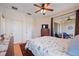 Bright bedroom with sliding glass doors to balcony, ceiling fan and dresser at 4209 Cascade Falls Dr, Sarasota, FL 34243