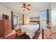 Main bedroom with a queen-size bed, water view, and ample closet space at 4209 Cascade Falls Dr, Sarasota, FL 34243