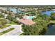 Community clubhouse with pool and surrounding landscape at 4209 Cascade Falls Dr, Sarasota, FL 34243